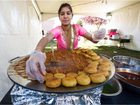 VANCOUVER, BC - October 27, 2019  - A woman serves meals during Diwali Mela at Lakshmi Narayan Temple in Surrey, BC, October 27, 2019.   (Arlen Redekop / PNG staff photo) (story by reporter [PNG Merlin Archive]