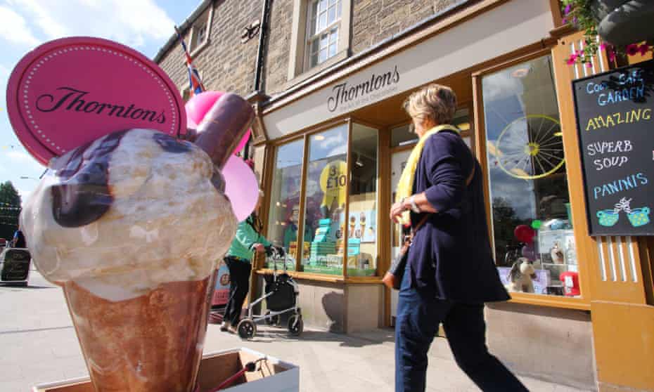 A woman walks by a Thorntons chocolate shop in Bakewell, Derbyshire