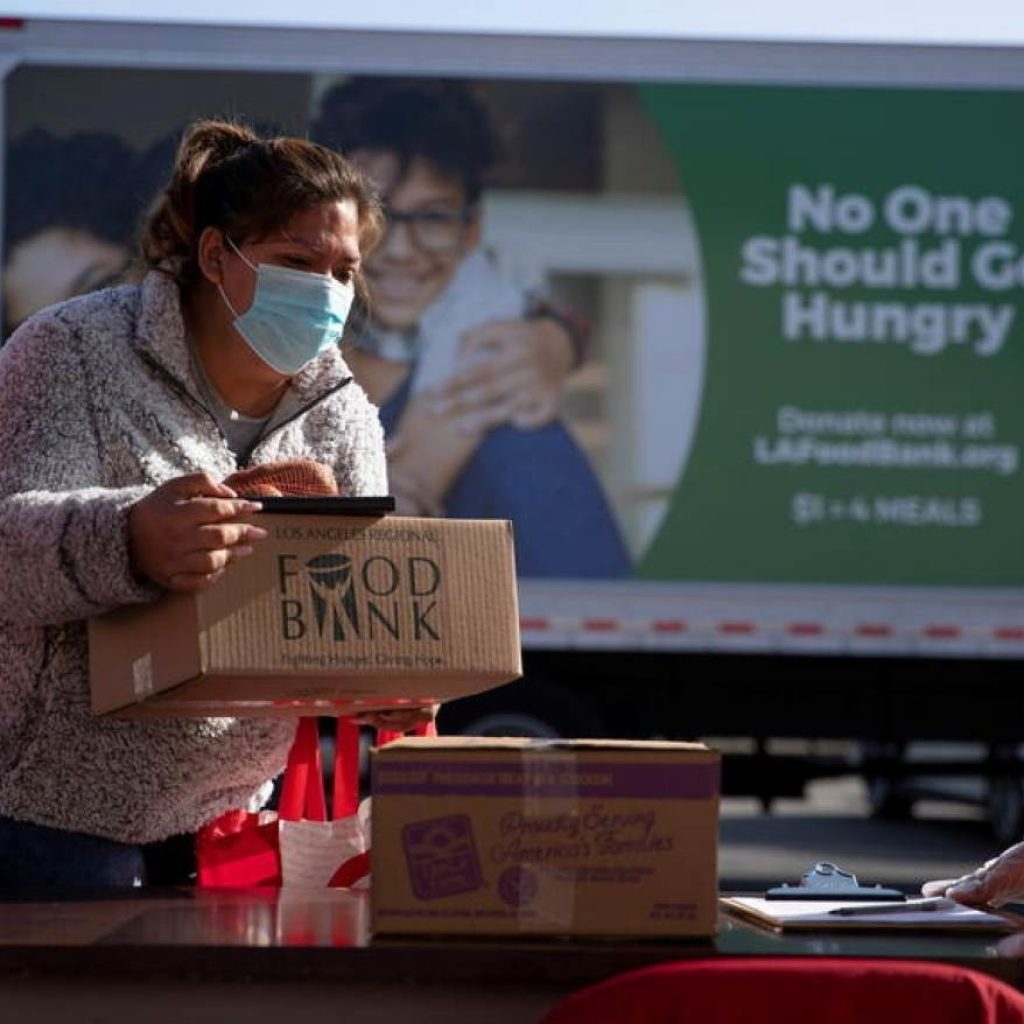 The Los Angeles Regional Food Bank distributes food outside a church during the outbreak of the coronavirus disease (COVID-19) in Los Angeles, California, U.S., November 19, 2020. 