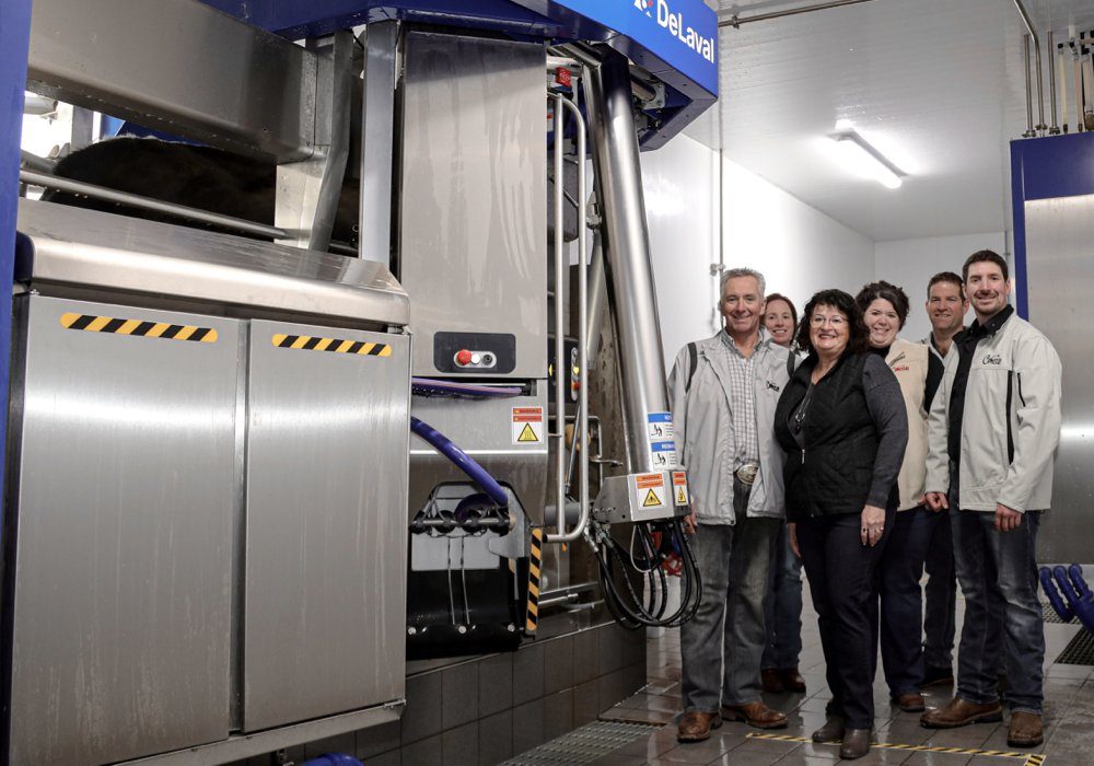 Marc Comtois, Kathleen Comtois, France Lemieux, Julie Comtois, Julien Turmel, and Steve Comtois in their new automated milking barn.