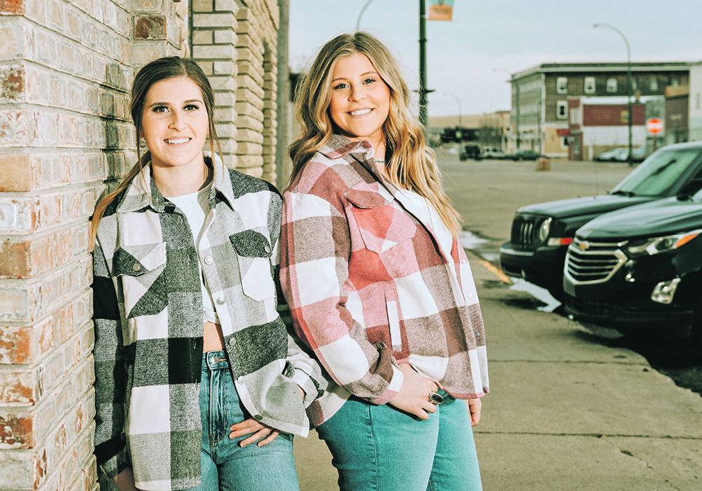 Tori, left, and Takaila Kendall showcase clothing from their online store, T Lazy T Boutique. The western clothing is inspired by their rural lifestyle. 