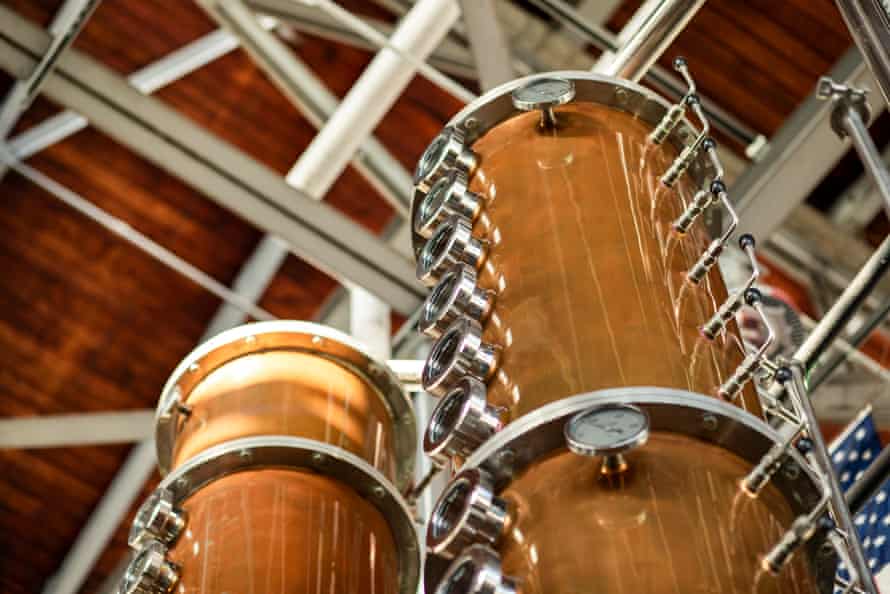 Copper distillery equipment stretches toward the ceiling at Hangar 1.