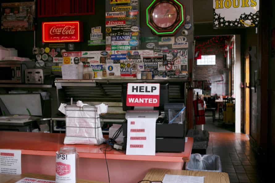 A help wanted sign is seen at the register of Burger Boy restaurant in Louisville, Kentucky.