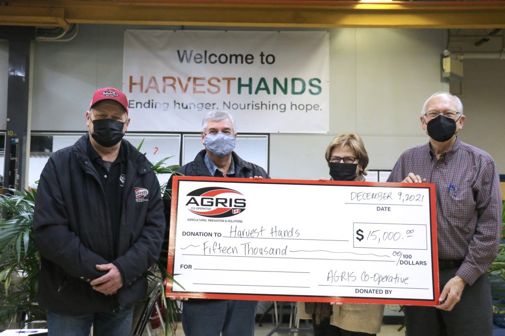 John Nooyen (left), AGRIS Co-operative board President and Jim Anderson (middle), AGRIS ownership committee chair, presents a donation to Harvest Hands. Jim and Jacintha Collins, founders, (right), accepts the donation on behalf of Harvest Hands. The $15,000 donation will be used to serve families and agencies in the communities surrounding AGRIS Co-operative.