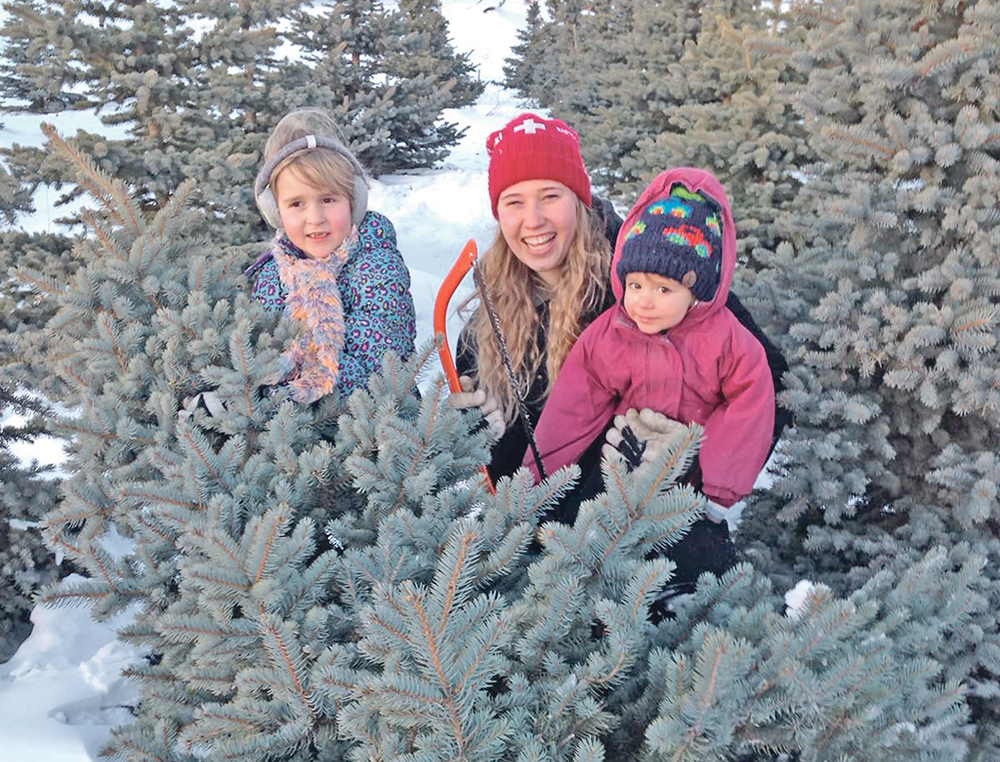 Amanda Kappeler (middle) is shown with neighbours on her family’s Fir Ever Green Farm near Falun, Alta.  