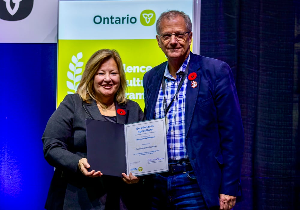 Ontario Minister of Agriculture Lisa Thompson presenting the 2023 Excellence in Research and Innovation award to Dave Smardon, CEO of Bioenterprise Canada at the Royal Agricultural Winter Fair last November.