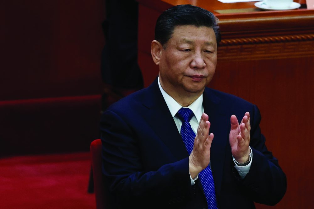 Chinese President Xi Jinping applauds at the closing session of the Chinese People's Political Consultative Conference (CPPCC) at the Great Hall of the People in Beijing, China March 10, 2024. REUTERS/Tingshu Wang