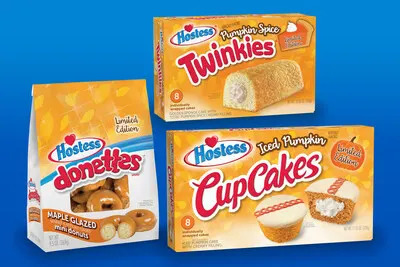 The returning snacks for autumn include Hostess Pumpkin Spice Twinkies, Hostess Iced Pumpkin CupCakes and Hostess Maple Glazed Donettes.