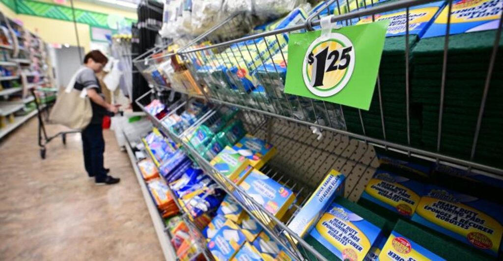 A shopper looks at product in a grocery aisle.jpg