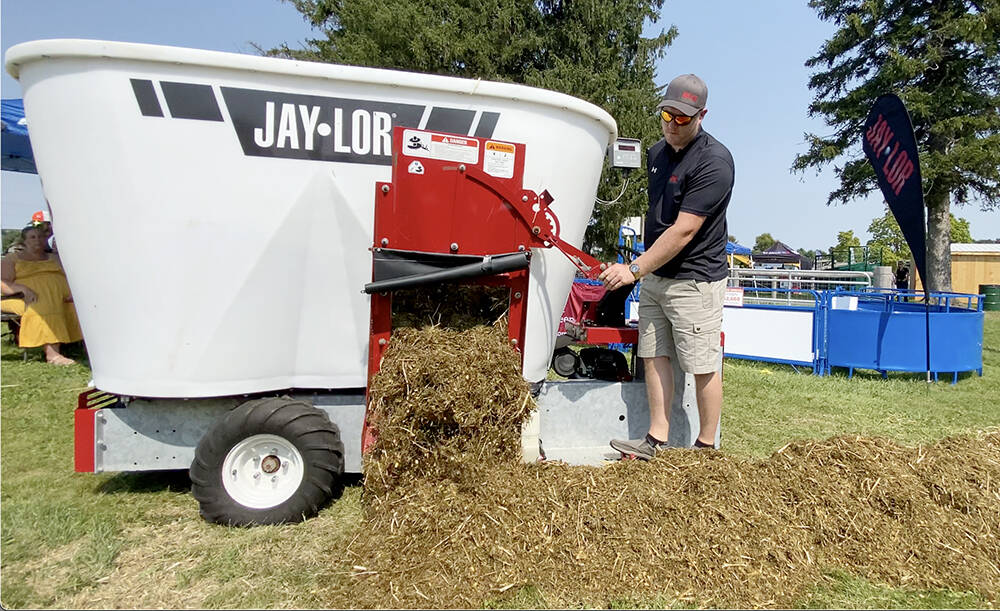 Jerry Oude Egberink, Ontario and Manitoba territory manager, releases a sheep TMR ration from the Jaylor mixer during a demonstration at Canada’s Outdoor Farm Show, Sept. 11, 2024.
