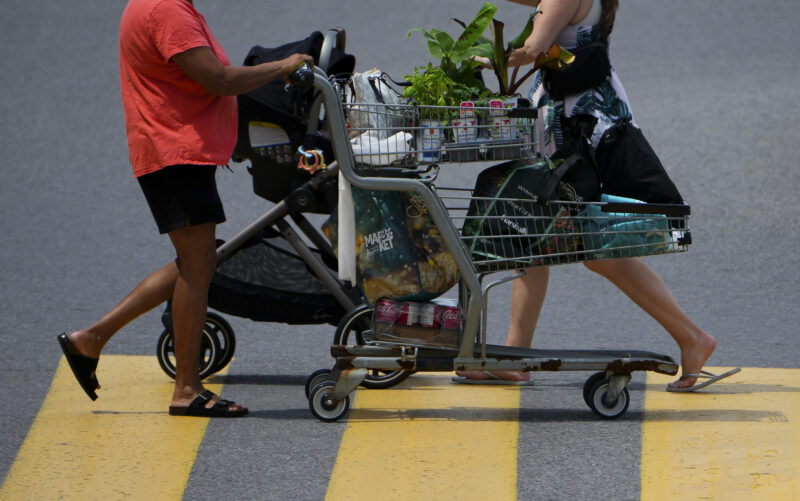 The Competition Bureau seeking information from grocery retailers and those in the real estate business about property controls in the Canadian grocery industry. Shoppers push carts in Ottawa on Tuesday, June 25, 2024. THE CANADIAN PRESS/Sean Kilpatrick