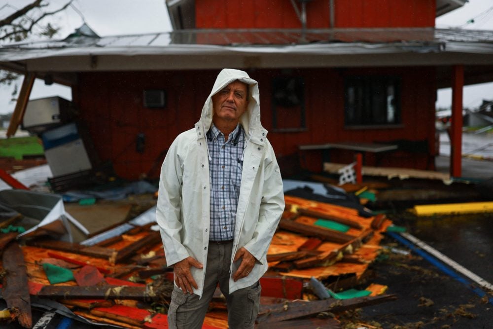 Jeff Schorner poses for a photo next to his business, Al’s Family Farms, which he lost during Hurricane Milton, in Lakewood Park, near Fort Pierce, in St. Lucie County, Florida, U.S., October 11, 2024. REUTERS/Jose Luis Gonzalez
