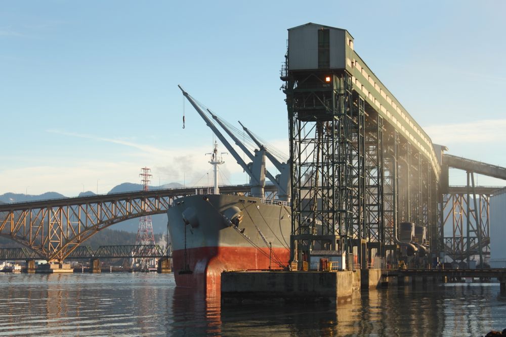 A freighter is loaded with grain from a terminal at Vancouver’s Burrard Inlet. (Maxvis/iStock/Getty Images)
