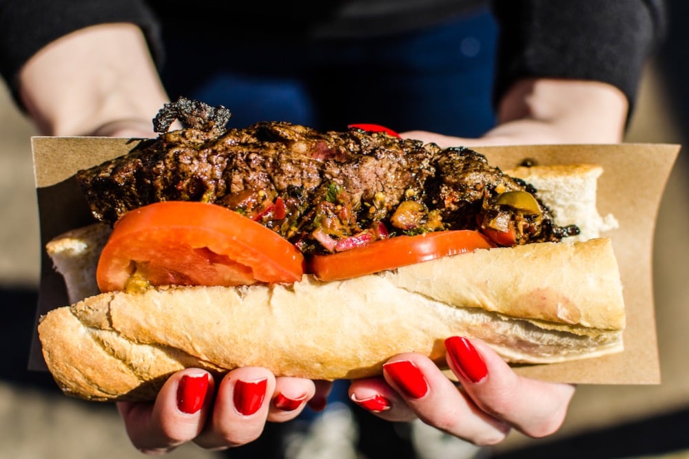 File photo of a steak sandwich with chimichurri sauce at a street food market in Buenos Aires. (Aleksandr_Vorobev/iStock/Getty Images)
