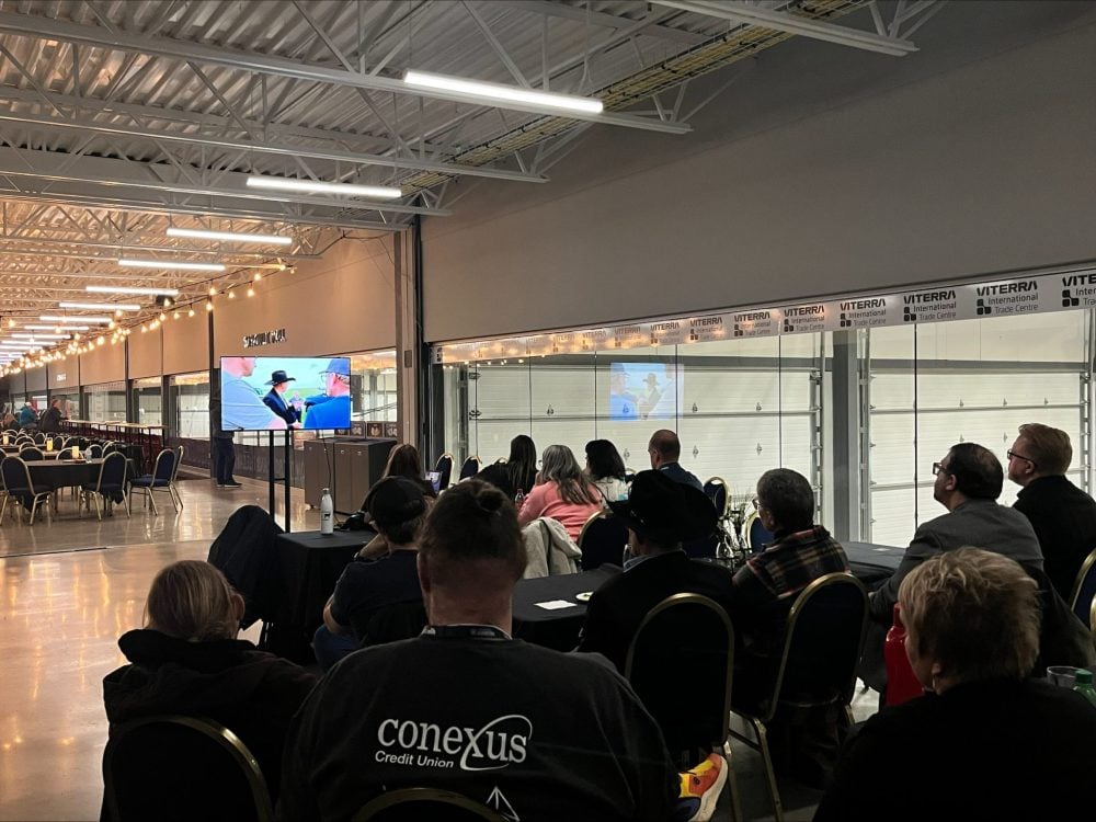 Launch attendees watch the first episode of the Western Producer’s documentary series, Welcome to the Farm Show, which was shown during Canadian Western Agribition. Photo: Melissa Jeffers-Bezan
