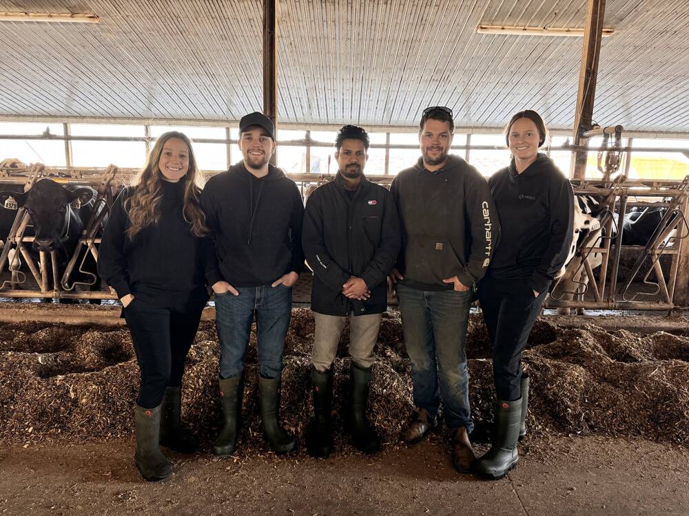 (L to R): Gina Portena, Marco Portena, Windulen Holsteins employee Damith Palleyalage, Ryan Portena and his wife Lindsay Portena. 