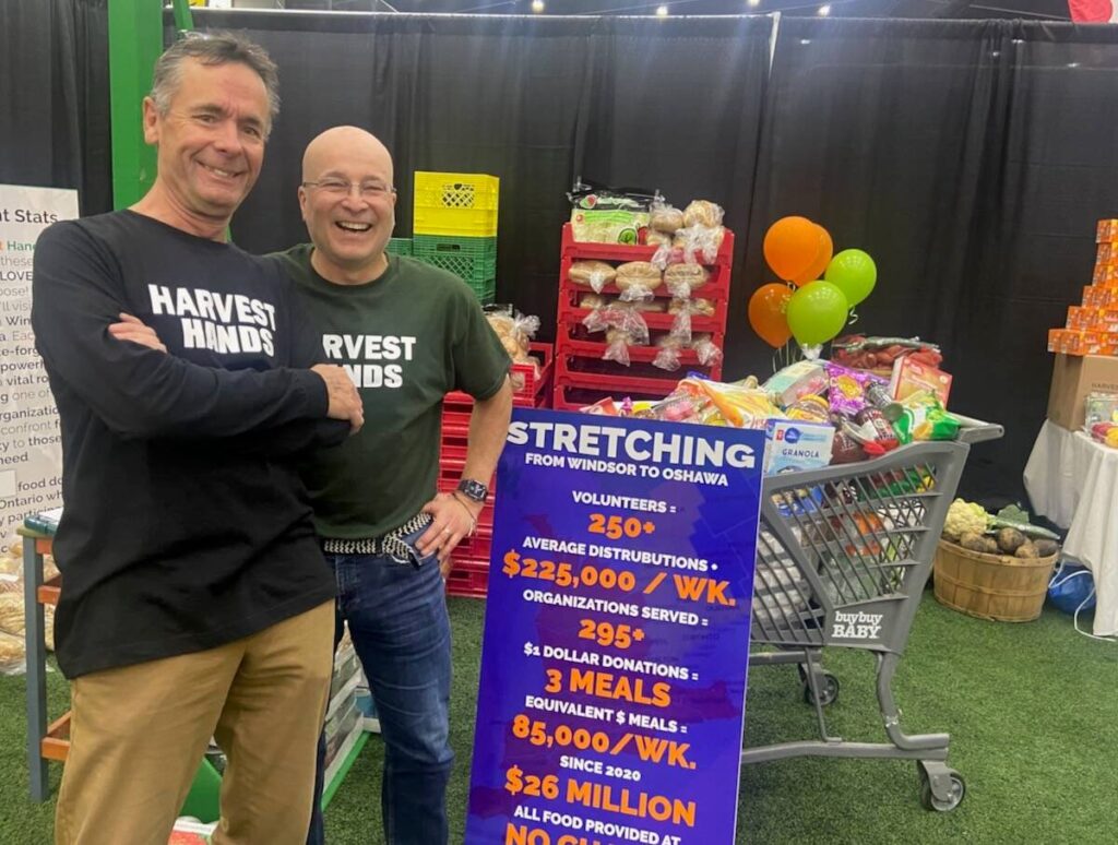 Paul Mansfield, left and Richard Chartrand are two volunteers with Harvest Hands who were talking to farmers at the London Farm Show. 