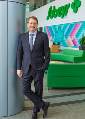 A person in a suit leaning against a wall

AI-generated content may be incorrect.