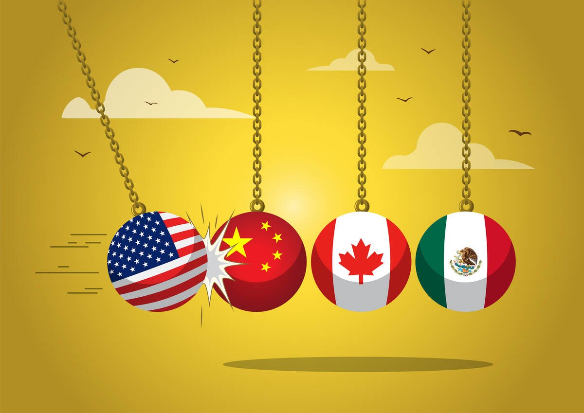 The flags of the U.S., China, Canada and Mexico are on four balls suspended on cables in a Newton's Cradle type of toy showing the U.S. ball slamming into that of China.