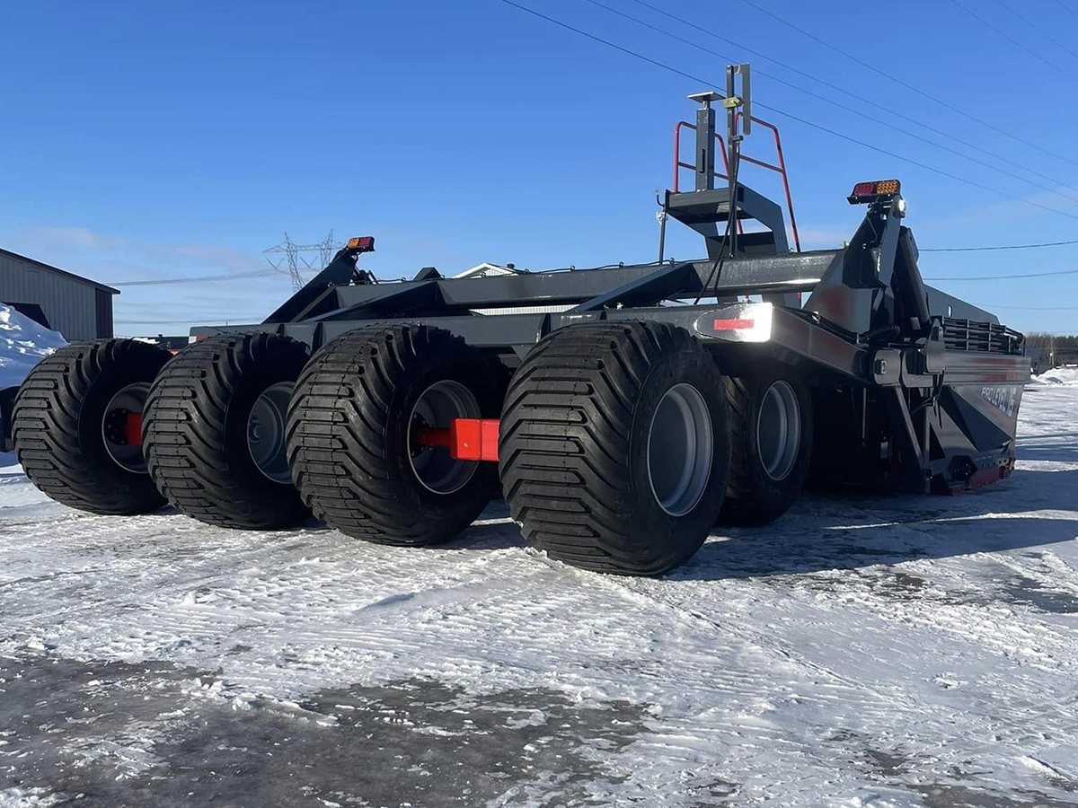 A picture of a Pro-Level 16XL scraper with special, wide, high-flotation tires described as 