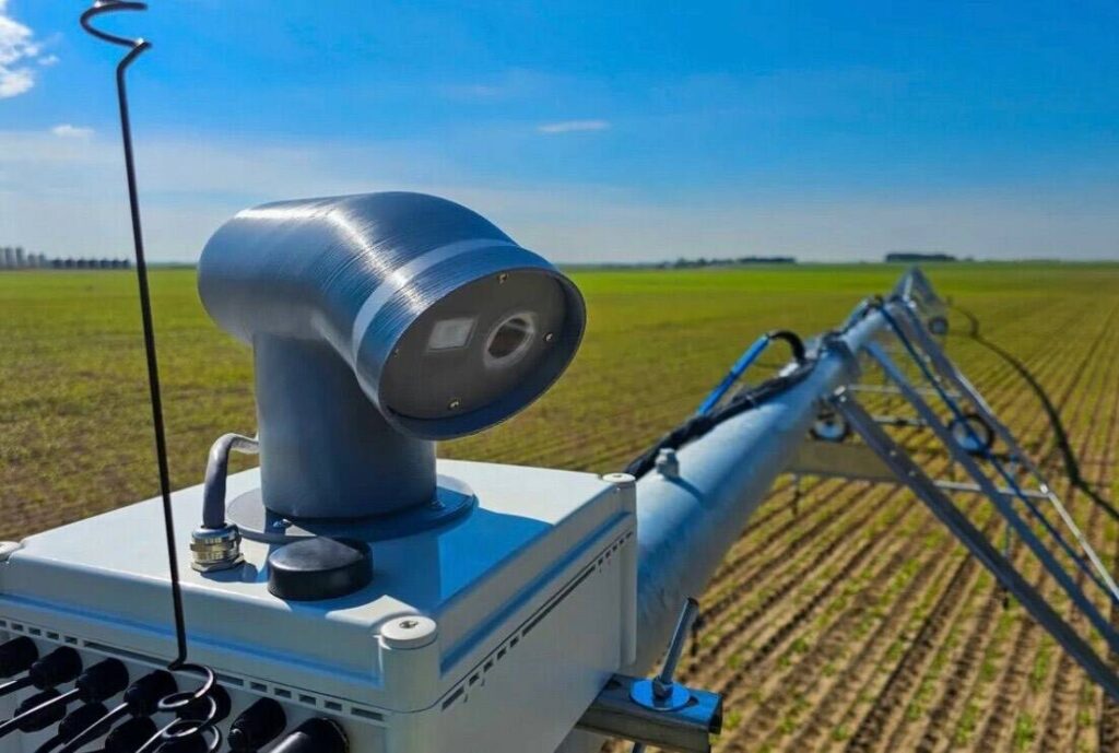 A multi-spectral sensor sits on each tower of the InteliRain variable rate irrigation system.