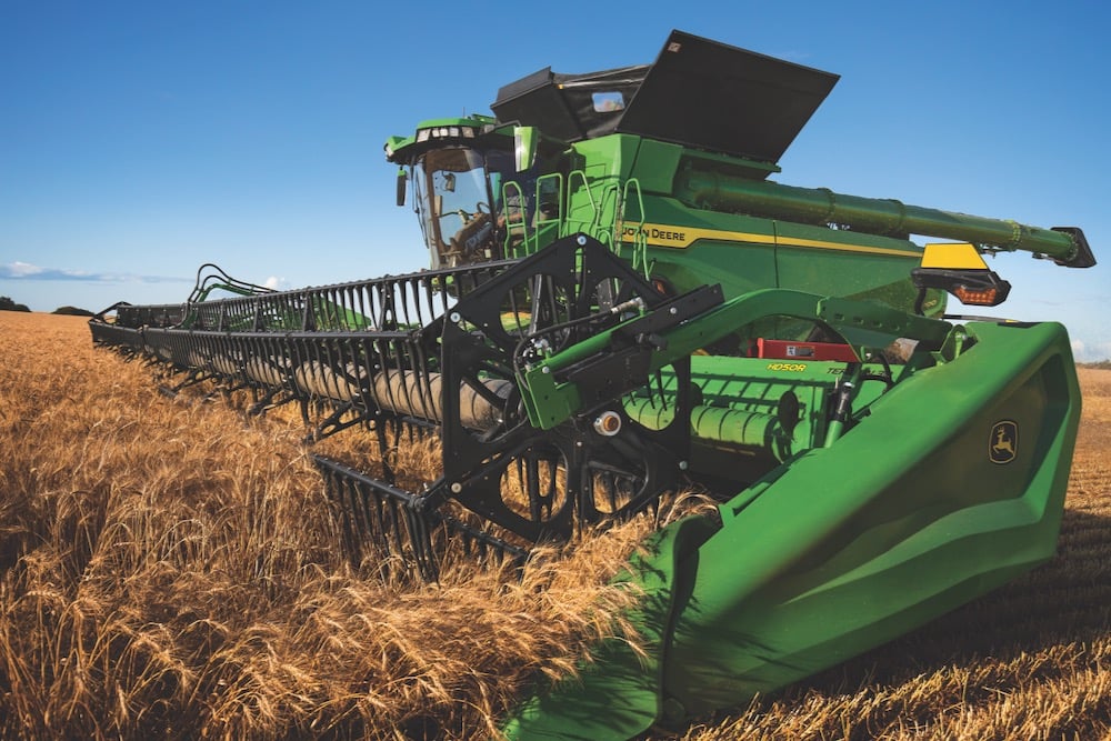 Deere tops second-quarter estimates, trims annual profit forecast