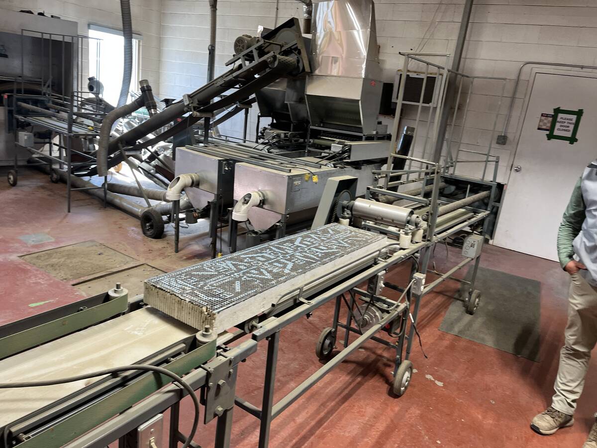 Equipment in a small room used to process bees.