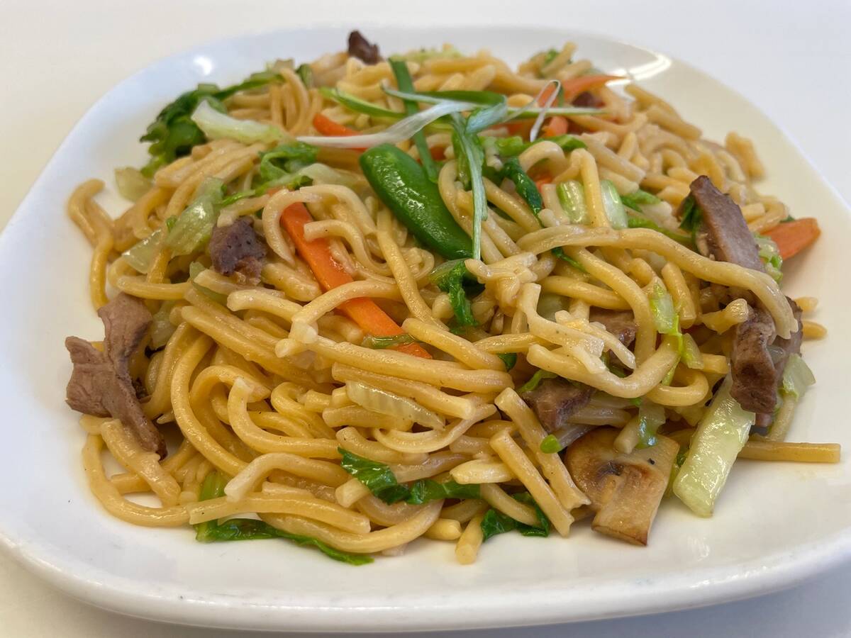 Barbecued pork lo mein on a plate.