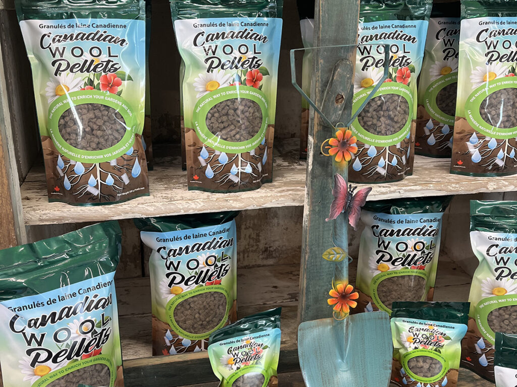 Bags of Canadian Wool Pellets are on display on a shelf at Canadian Fibre Mill near Caron, Sask.