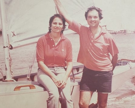 An archive picture of a couple leaning against a yacht