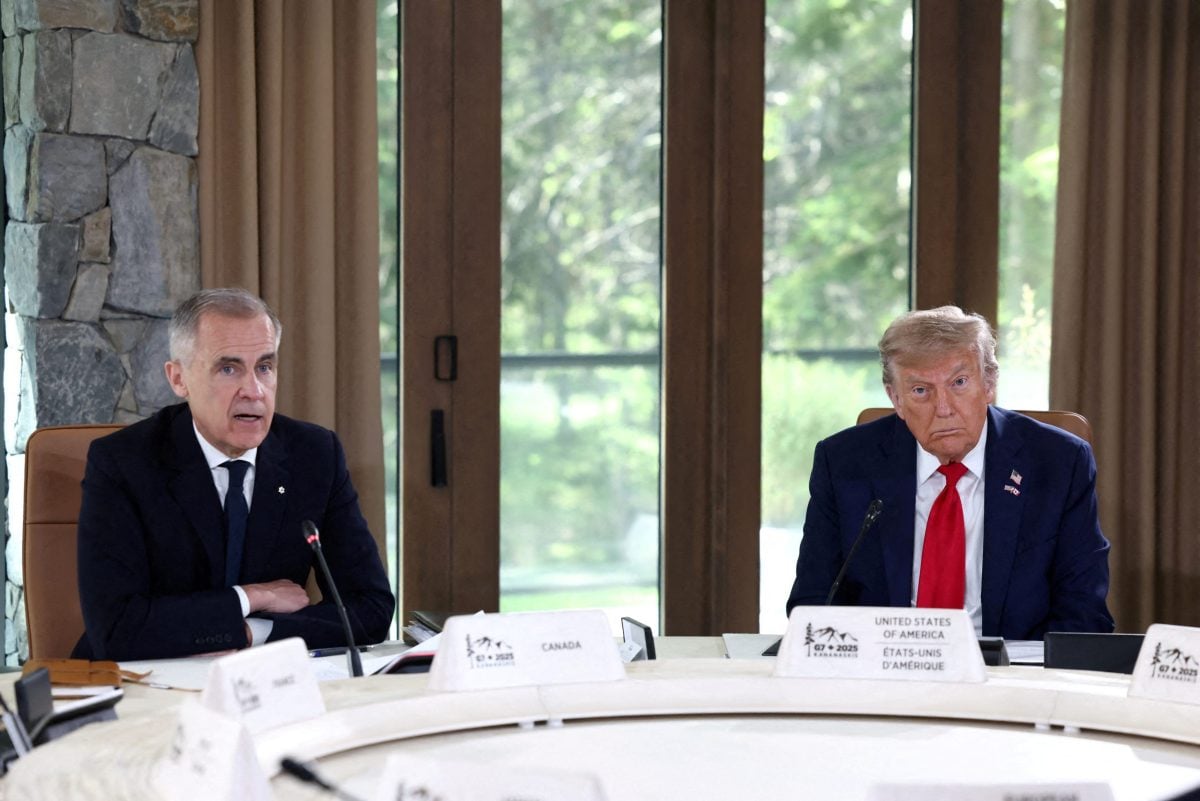 FILE PHOTO: U.S. President Donald Trump and Canadian Prime Minister Mark Carney attend a meeting with G7 leaders and guests, at the G7 summit in Kananaskis, Alberta, Canada,  June 16, 2025.  REUTERS/Kevin Lamarque/File Photo
