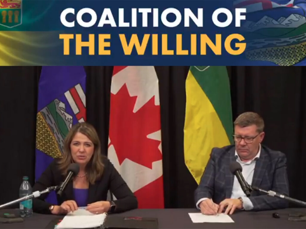 Alberta Premier Danielle Smith and Saskatchewan Premier Scott Moe address reporters following a joint meeting of provincial officials in Lloydminster on June 18.