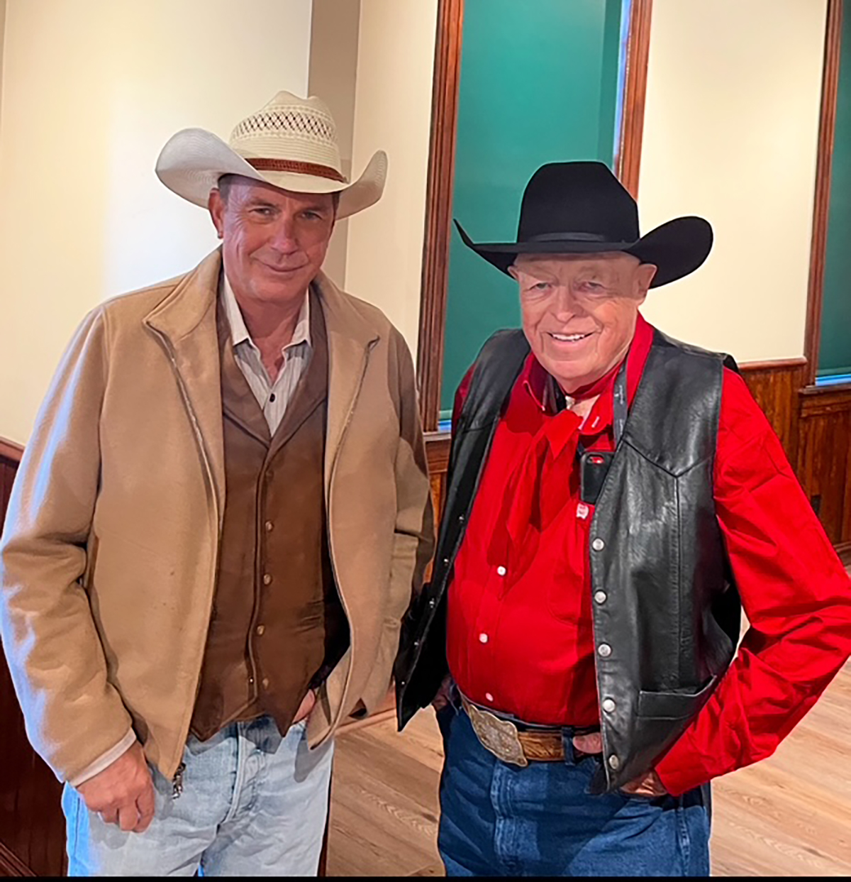 John Scott poses with Kevin Costner when the two were parade marshals for the 2022 Calgary Stampede.