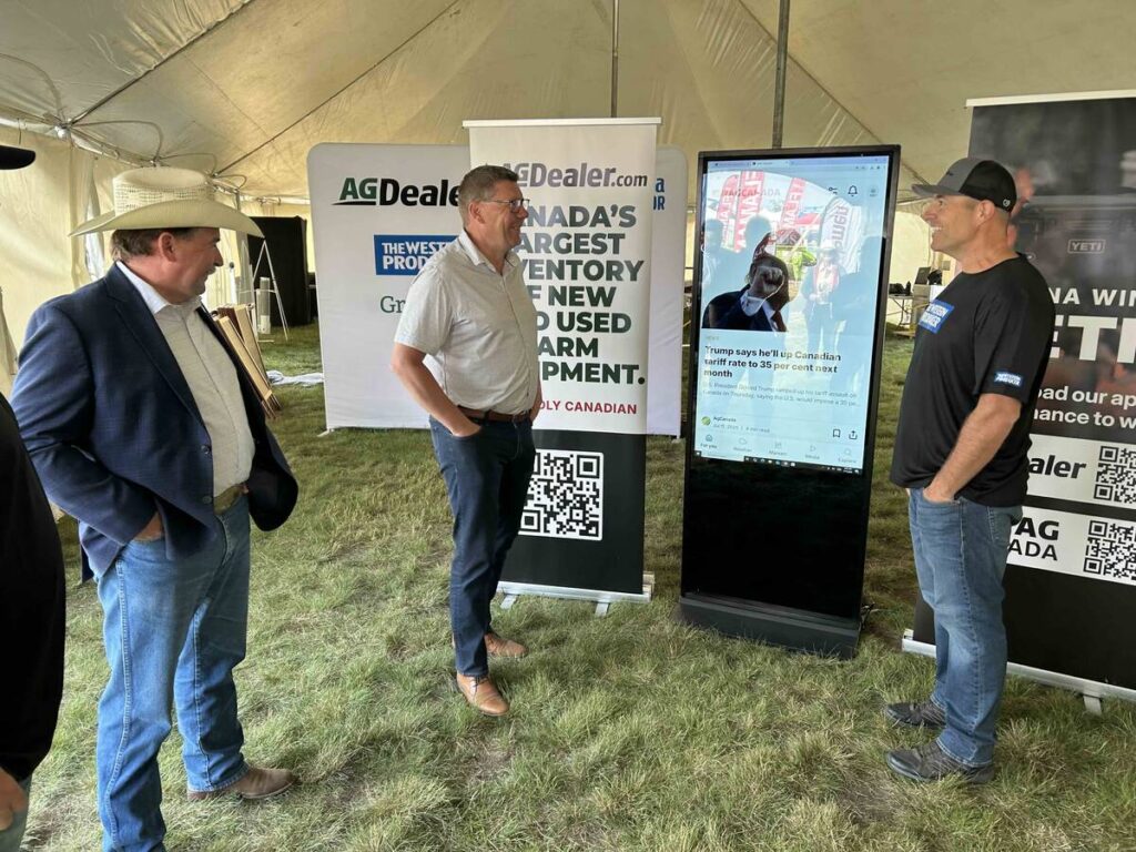 Provincial ag minister Daryl Harrison, Premier Scott Moe and GFM EVP Ryan Green at Ag In Motion 2025.