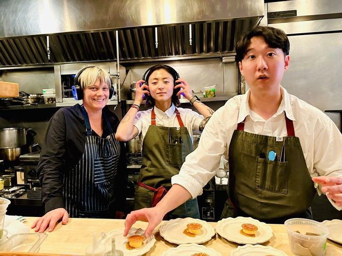 Chef Andrea Carlson, left, with her staff cooking at Taste Sound dinner at Burdock and Co. on Main Street in Vancouver