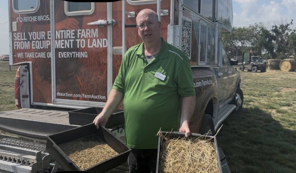 Dwayne Summach, livestock and feed extension specialist with the Saskatchewan Ministry of Agriculture, demonstrates how to use the Penn State Particle Size Separator at Ag in Motion 2025. Photo: Piper Whelan
