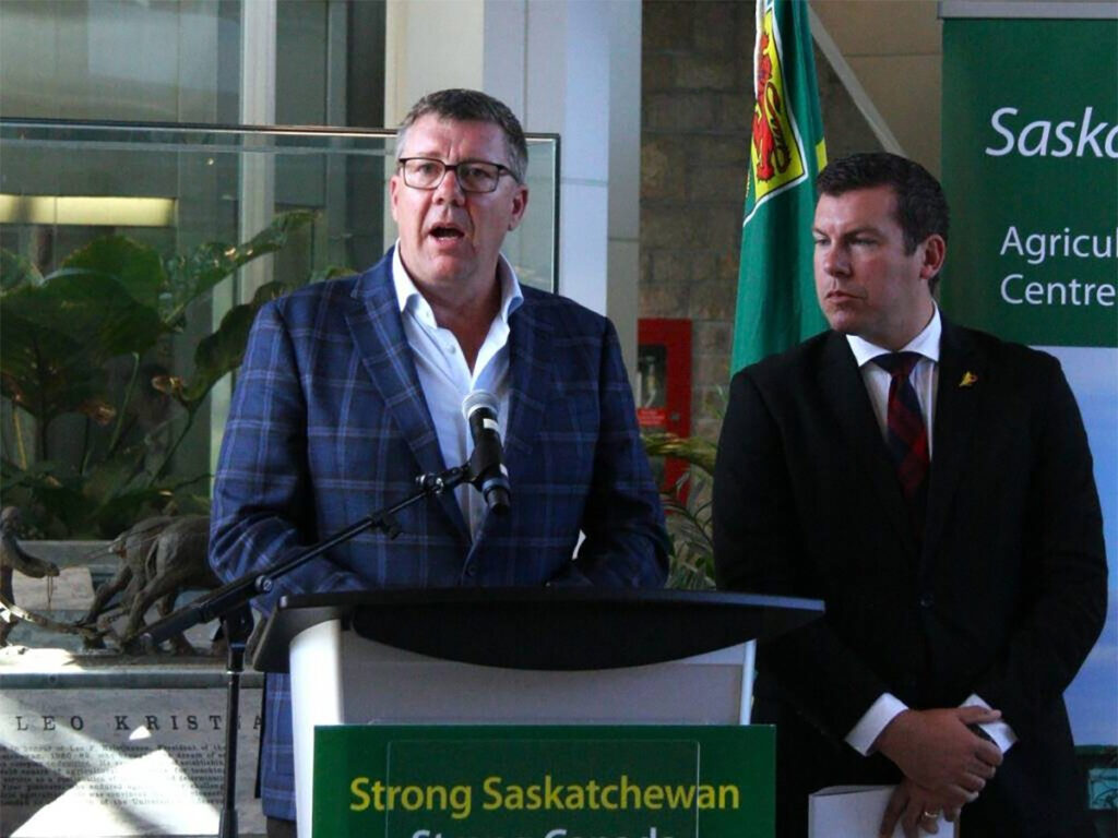 Saskatchewan premier Scott Moe, left, and Kody Blois, parliamentary secretary to the prime minister, participate in a press conference prior to their mission to China.