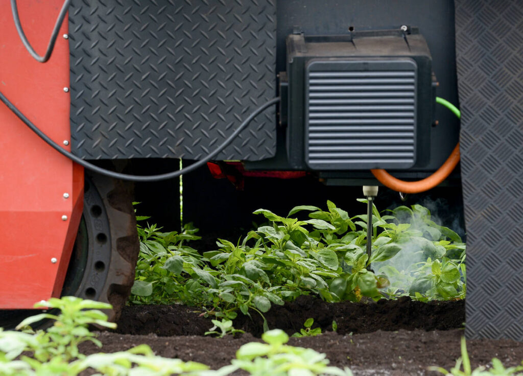 Smoke can be seen rising from near a metal 