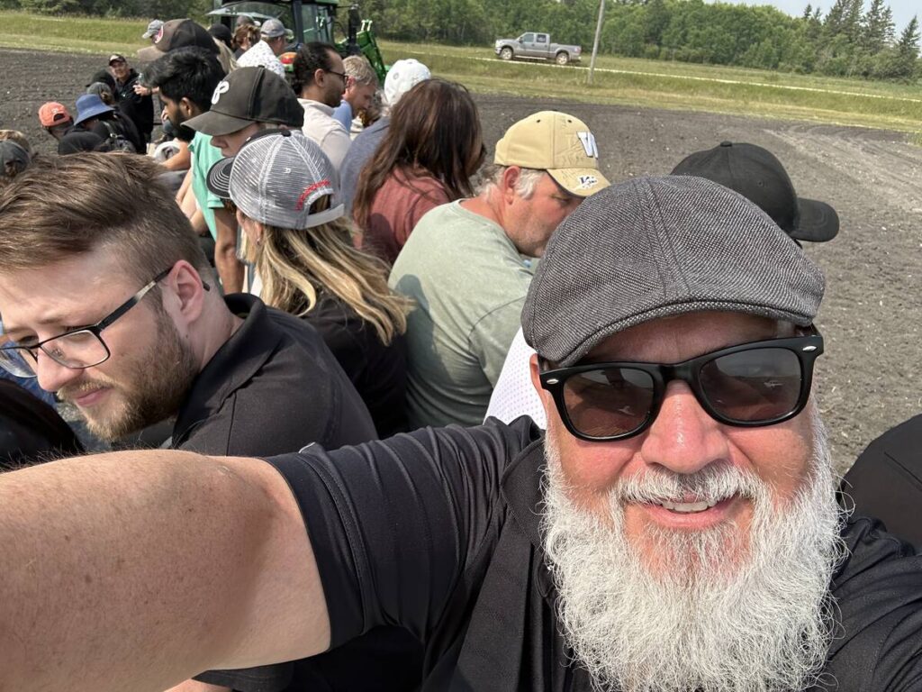 Don Norman takes a selfie of himself and mire than a dozen others piled onto what he calls 