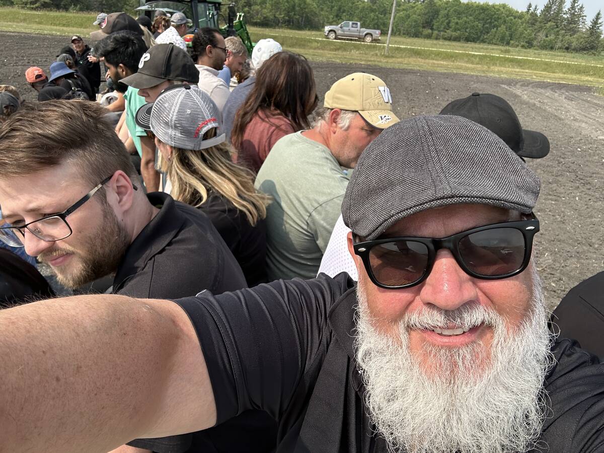 Don Norman takes a selfie of himself and mire than a dozen others piled onto what he calls 