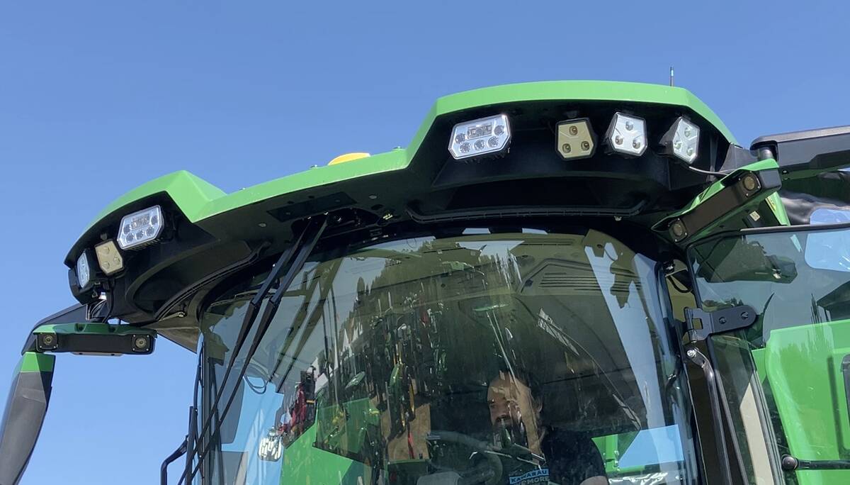 An attendee checks out the view from the driver’s seat of a John Deere S7 combine at Canada’s Outdoor Farm Show on Sept. 11.  Photo: Greg Berg