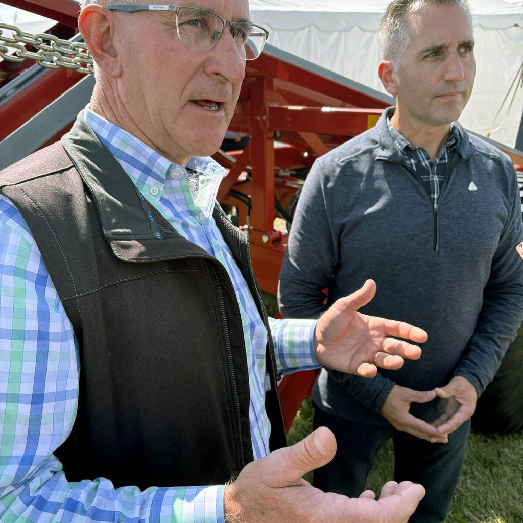 Russell Redding, Pennsylvania Secretary of Agriculture, foreground, and Trevor Jones, Ontario Minister of Agriculture, Food and Agribusiness, spent time in the Innovation in Agriculture tent at Canada's Outdoor Farm Show and touring the site on Sept. 10, 2025, . The men said, despite trade issues, farmers on each side of the border share the same goal and concerns when it comes to raising food.