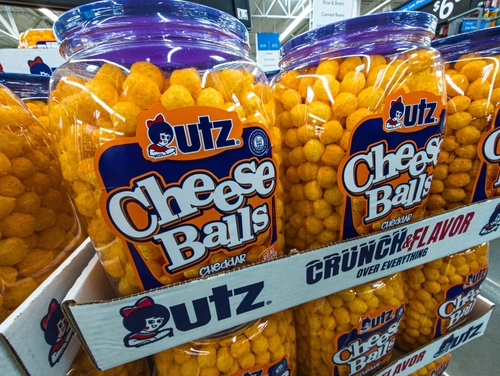 Utz Cheese Balls on store shelves, part of the brand’s portfolio transitioning to FD&C-free products by 2027
