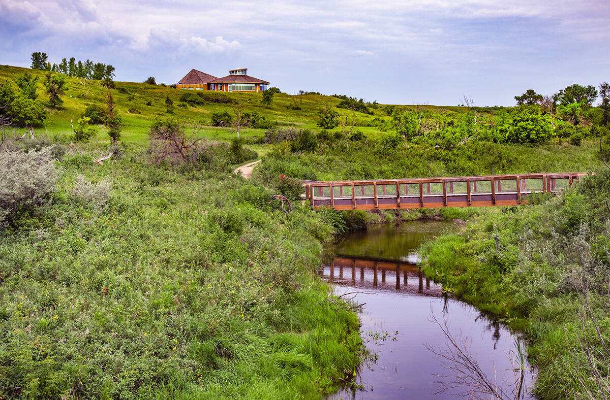 Opimihaw Creek, with a small bridge across it, in Wanuskewin Heritage Park.
