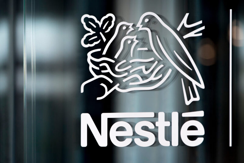 FILE - In this Thursday, Feb. 14, 2019, file photo, Nestle's logo is displayed on a window, during the 2018 full-year results press conference of the food and drinks giant Nestle, in Vevey. (Laurent Gillieron/Keystone via AP, File)