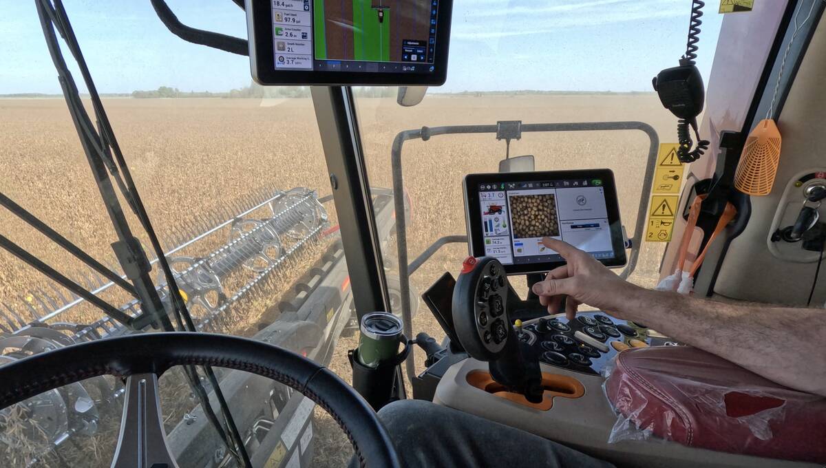 A view from inside the cab of the new Case IH AF11 combine showing the machine's Harvest Command Automation system.
