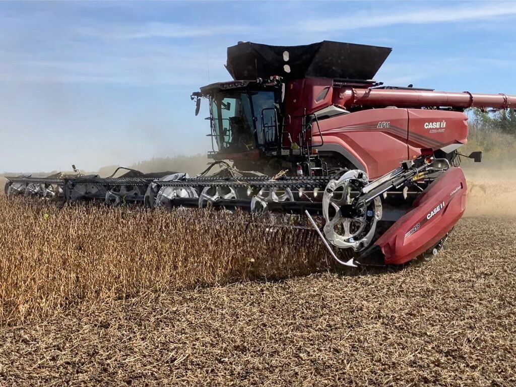 The New Agco AF11 combine at work on a field of soybeans.