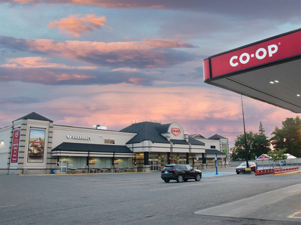 The view from the parking lot of a Federated Co-Op grocery store with the overhead shelter of a Co-Op gas bar just visible at the upper right side of the image.