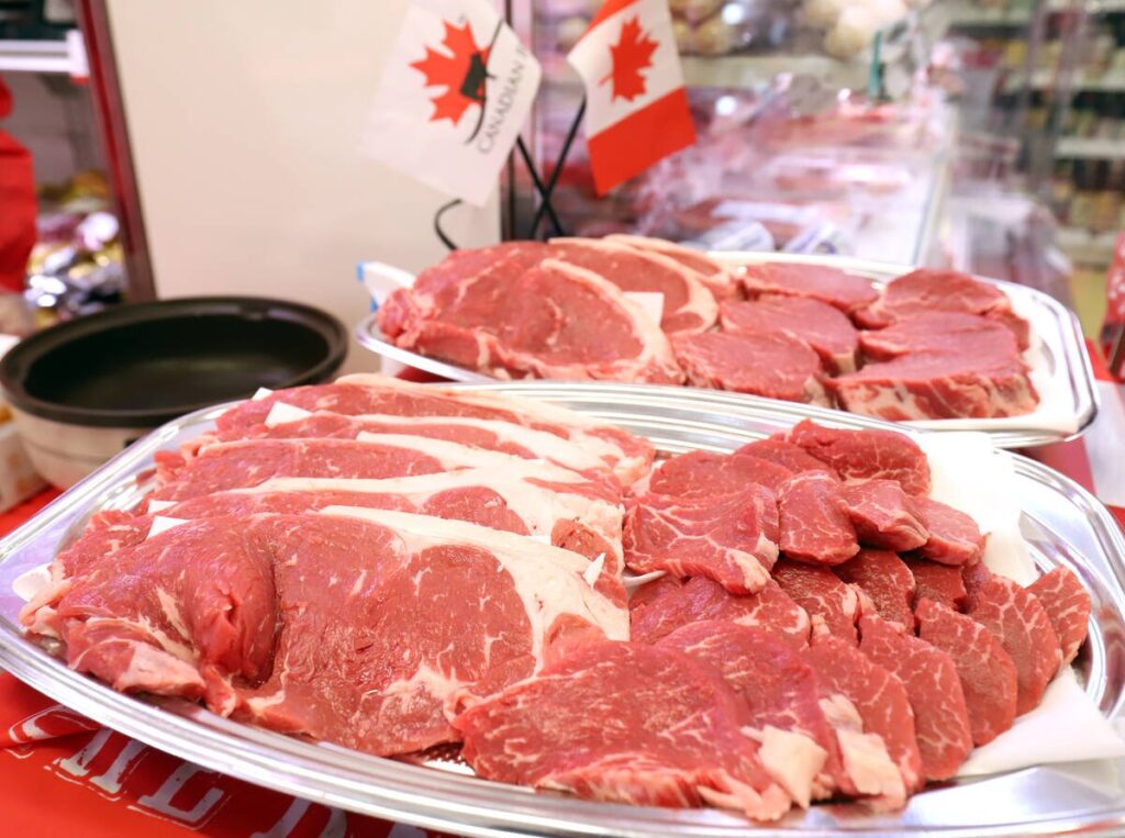 Sliced Canadian beef is displayed on dishes for tasting at the Nissin World Delicatessen supermarket in Tokyo.