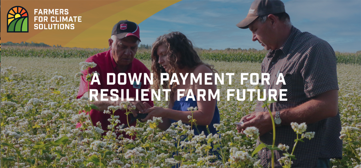 A screencap from the Farmers for Climate Solutions website showing two men and a woman in a field closely examining a crop with the words, "A down payment for a resilient farm future" overtop the image.